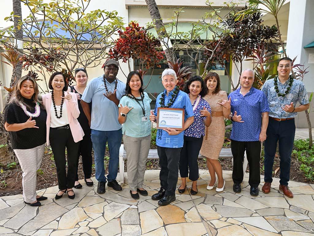 HPU President John Gotanda (center) joined by members of the Blue Zones Project and HPU staff